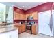Kitchen features stainless steel appliances, granite countertops, and tile floors at 3292 Covered Bridge E Dr, Dunedin, FL 34698