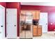 Kitchen with stainless steel refrigerator, granite countertops, and modern appliances at 3292 Covered Bridge E Dr, Dunedin, FL 34698