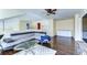 Spacious living room with wood floors, a sectional sofa, and a glass coffee table at 3292 Covered Bridge E Dr, Dunedin, FL 34698