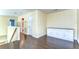 An open loft space features hardwood floors and built-in cabinetry, providing versatile functionality at 3292 Covered Bridge E Dr, Dunedin, FL 34698