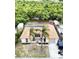 Charming home features a unique tile roof and lush landscaping bordering a serene waterway at 3301 Elkridge Dr, Holiday, FL 34691