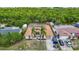 Lovely home features a tile roof and is surrounded by lush greenery and a peaceful waterway at 3301 Elkridge Dr, Holiday, FL 34691