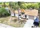 Single Gathering home with updated tile roof, well-manicured landscaping, and a spacious driveway at 3301 Elkridge Dr, Holiday, FL 34691