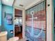 Nautical-themed bathroom with blue shiplap, featuring an anchor shower curtain at 3301 Elkridge Dr, Holiday, FL 34691