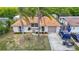 Charming single-story home with a terracotta roof and a well-maintained yard at 3301 Elkridge Dr, Holiday, FL 34691