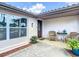 Charming front entrance features updated paint and a cozy seating area at 3301 Elkridge Dr, Holiday, FL 34691