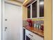 Kitchen features custom cabinets, colorful backsplash, and wooden countertops at 3301 Elkridge Dr, Holiday, FL 34691
