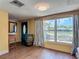 Bright living room with wood floors and a large window at 3301 Elkridge Dr, Holiday, FL 34691