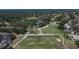 Panoramic community aerial view featuring a golf course and lush surroundings at 3314 Cypress Landing Dr, Valrico, FL 33596
