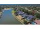 An aerial shot displays a well-maintained home featuring a screened-in pool at 3314 Cypress Landing Dr, Valrico, FL 33596