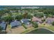 An aerial view showcasing a home with a screened-in pool and well-maintained yard at 3314 Cypress Landing Dr, Valrico, FL 33596