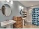 Bright bathroom with double sinks and a shower with tub combination and stylish fixtures at 3314 Cypress Landing Dr, Valrico, FL 33596