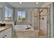 Bathroom boasts double sinks, a soaking tub, and a glass enclosed shower stall at 3314 Cypress Landing Dr, Valrico, FL 33596