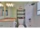 Bright bathroom featuring a shower and tub combination with a neutral granite-style vanity at 3314 Cypress Landing Dr, Valrico, FL 33596