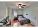 Cozy bedroom with wood floors, ceiling fan and natural light at 3314 Cypress Landing Dr, Valrico, FL 33596