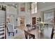 Dining room with high ceilings, staircase and doorway access to laundry room at 3314 Cypress Landing Dr, Valrico, FL 33596