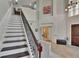 Grand entryway featuring a staircase with decorative iron spindles, high ceilings and a modern chandelier at 3314 Cypress Landing Dr, Valrico, FL 33596