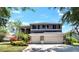 Two-story home featuring a three-car garage and well-maintained landscaping at 3314 Cypress Landing Dr, Valrico, FL 33596