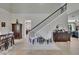 Bright and airy foyer with tile floors, staircase, and stylish furnishings at 3314 Cypress Landing Dr, Valrico, FL 33596