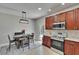 This modern kitchen has stainless appliances, granite countertops, ample wood cabinetry and an outdoor view at 3314 Cypress Landing Dr, Valrico, FL 33596