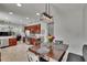 An open kitchen features stainless appliances, granite counters, and a direct view to the dining area at 3314 Cypress Landing Dr, Valrico, FL 33596