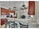 An open kitchen features granite counters, bar seating, stainless appliances, and view to the dining area at 3314 Cypress Landing Dr, Valrico, FL 33596