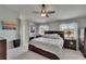 Comfortable main bedroom features neutral tones, ceiling fan, and an abundance of natural light at 3314 Cypress Landing Dr, Valrico, FL 33596