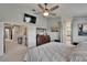 View of the main bedroom reveals neutral walls, ceiling fan and entry to bathroom at 3314 Cypress Landing Dr, Valrico, FL 33596