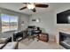 A home office area features a fireplace, a large window and a ceiling fan at 3314 Cypress Landing Dr, Valrico, FL 33596