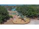 Aerial view of the expansive community playground, offering a climbing wall and multiple slides at 3314 Cypress Landing Dr, Valrico, FL 33596