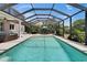 A spacious screened-in pool with patio furniture and covered area at 3314 Cypress Landing Dr, Valrico, FL 33596