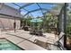 Screened-in pool featuring outdoor seating, a dining table, and a sun lounger at 3314 Cypress Landing Dr, Valrico, FL 33596