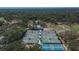 Aerial view of tennis courts and lush landscaping in the community at 3314 Cypress Landing Dr, Valrico, FL 33596