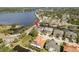 Aerial view of home on canal with lush landscaping and a waterway view at 339 Manatee Ln, Tarpon Springs, FL 34689