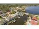 Scenic aerial view of waterfront homes featuring private docks and serene water access, highlighting a beautiful community at 339 Manatee Ln, Tarpon Springs, FL 34689