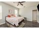 This bedroom features a dark wood floor, a ceiling fan and bright light at 339 Manatee Ln, Tarpon Springs, FL 34689