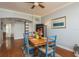 Dining room features a wooden table, blue chairs, and a decorative rug at 339 Manatee Ln, Tarpon Springs, FL 34689