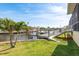 Dock and boat slip on canal with grass yard and steps at 339 Manatee Ln, Tarpon Springs, FL 34689
