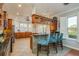 Kitchen featuring an island with barstools, granite countertops, and stainless steel appliances at 339 Manatee Ln, Tarpon Springs, FL 34689