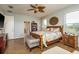 Spacious main bedroom with wood floors and adjoining bath at 339 Manatee Ln, Tarpon Springs, FL 34689