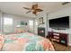 Comfortable main bedroom features a fireplace and large television at 339 Manatee Ln, Tarpon Springs, FL 34689