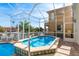 Relaxing inground spa in screened enclosure overlooking the canal at 339 Manatee Ln, Tarpon Springs, FL 34689