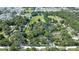 Expansive parcel of land with mature trees and a lush green meadow, ready for your dream home at 37348 Tucker Rd, Zephyrhills, FL 33541
