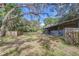 Large barn with multiple stalls and a spacious grassy area at 37348 Tucker Rd, Zephyrhills, FL 33541