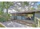 Exterior of a barn with wooden fencing and an open stall, providing functional outdoor space at 37348 Tucker Rd, Zephyrhills, FL 33541