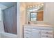 Bright bathroom featuring vanity with storage, combined tub/shower, and ample lighting for a refreshing experience at 37348 Tucker Rd, Zephyrhills, FL 33541