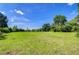 Beautiful grassy land, perfect for building or recreation under a clear blue sky at 37348 Tucker Rd, Zephyrhills, FL 33541