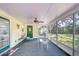 Relaxing screened porch with outdoor seating and a view of the backyard at 37348 Tucker Rd, Zephyrhills, FL 33541