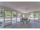 Spacious screened-in porch perfect for outdoor dining and relaxation at 37348 Tucker Rd, Zephyrhills, FL 33541