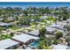 An elevated shot of a coastal community featuring single-story homes and waterfront views at 4018 Indianapolis Ne St, St Petersburg, FL 33703